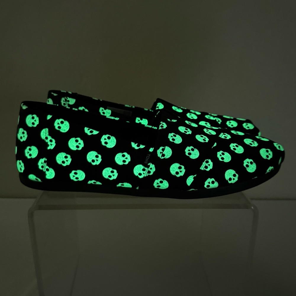 Toms Black Slip-On Shoes with Glow Green Skull Pattern